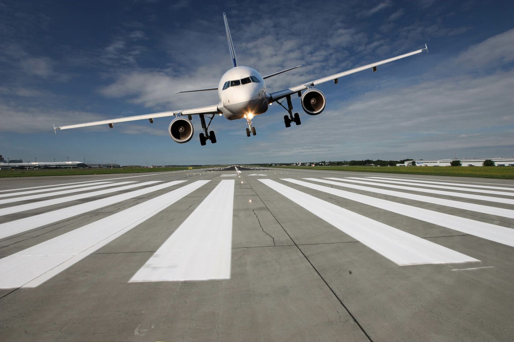 Plane over the runway