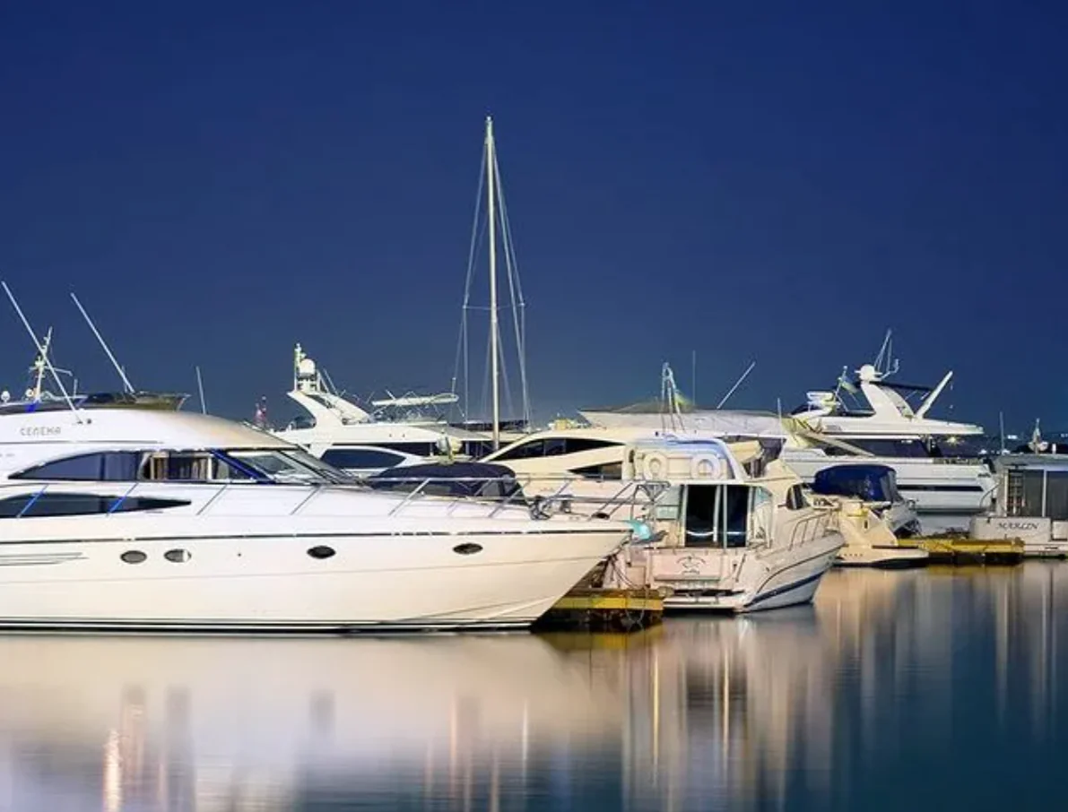 Yachts parked at the pier